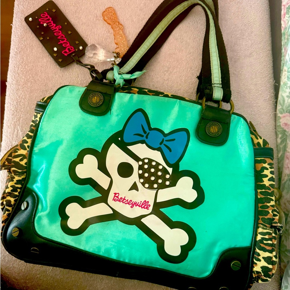 Vintage Betseyville Skull and crossbones turquoise and leopard print satchel.